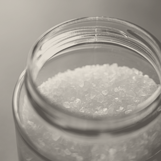 Washed fine salt in a glass jar, milled small enough to pour.